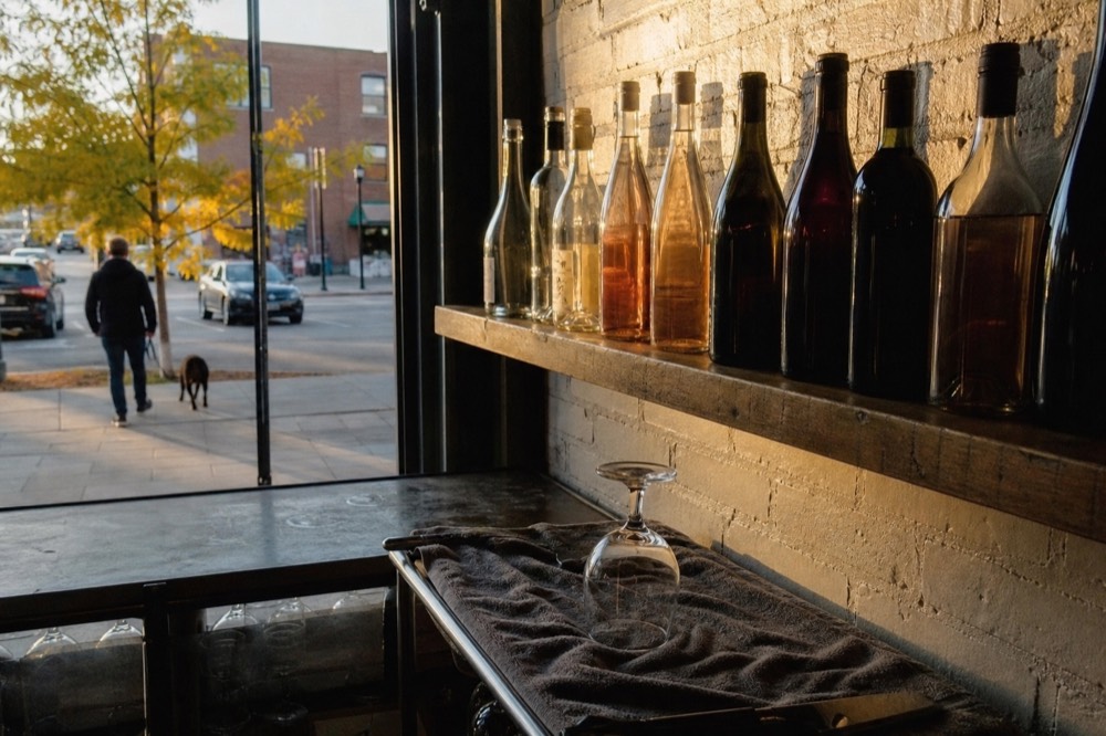 Award-winning wine bottles lined up on a tasting room shelf